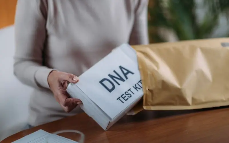 senior woman preparing dna genetic test kit
