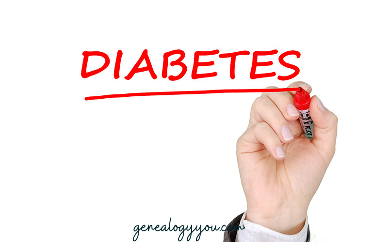 hand writing the word diabetes with a red color marker