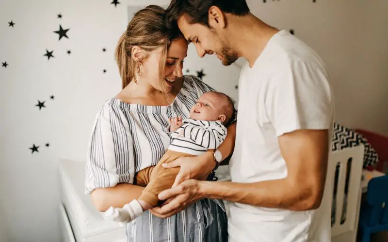 Photo of a man, a woman and a baby