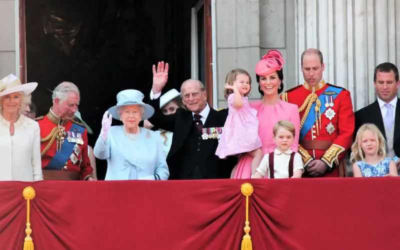 Photo of Queen Elizabeth II, Prince Philip and other members of royal family on a palace balcony with red drapes