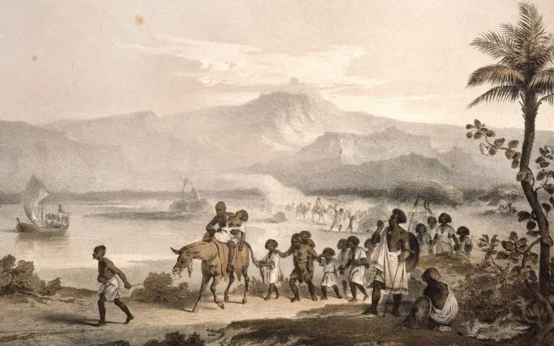 A very old photo or painting that shows children and adult Africans who were taken as slaves with some riding a donkey with river and some boats or ships and mountains on background